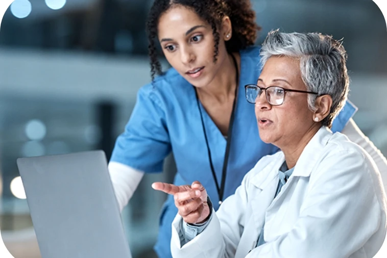 image of healthcare providers looking at computer screen