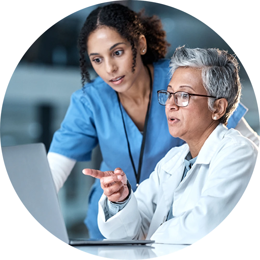 image of healthcare providers looking at a computer screen